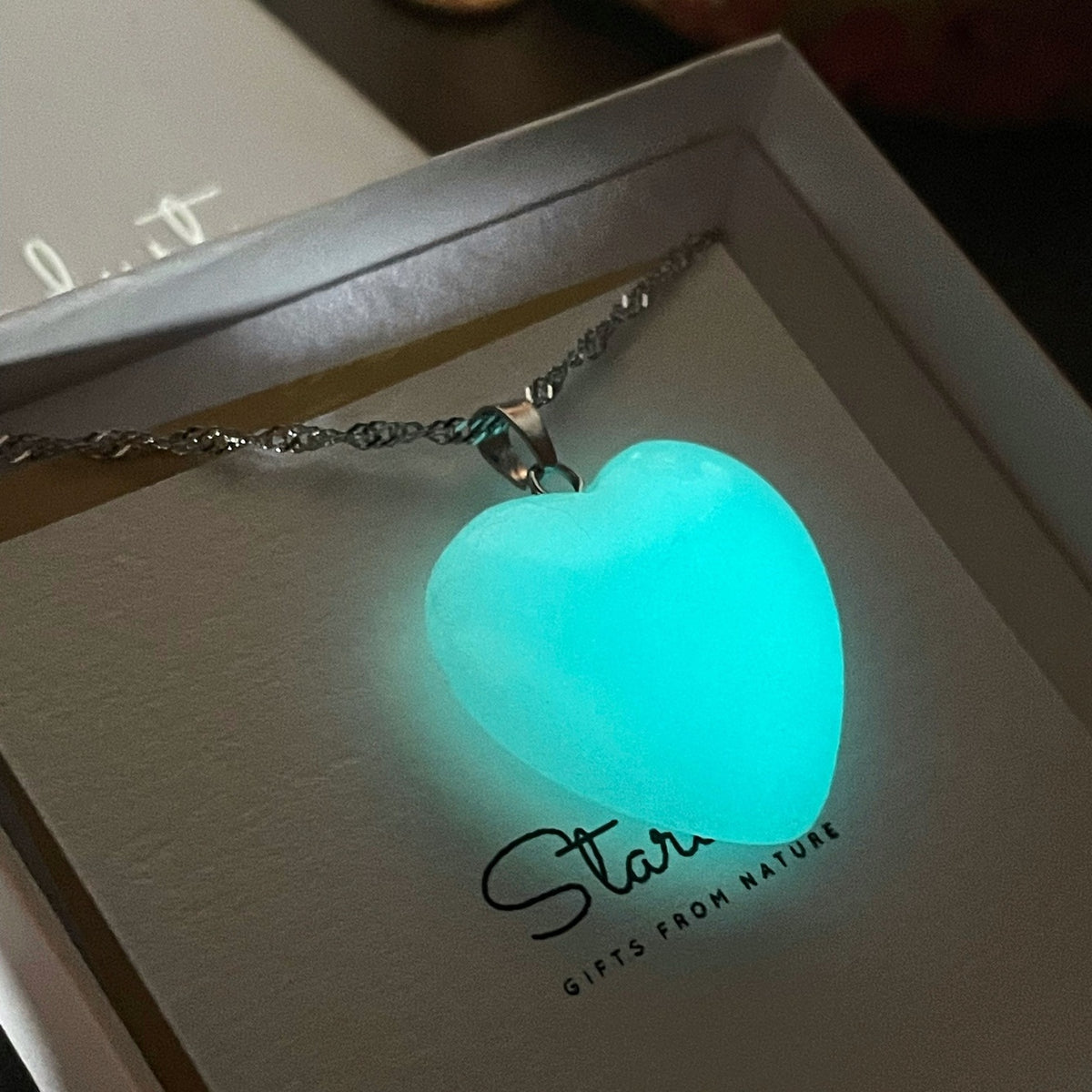 Glowing heart pendant in dark