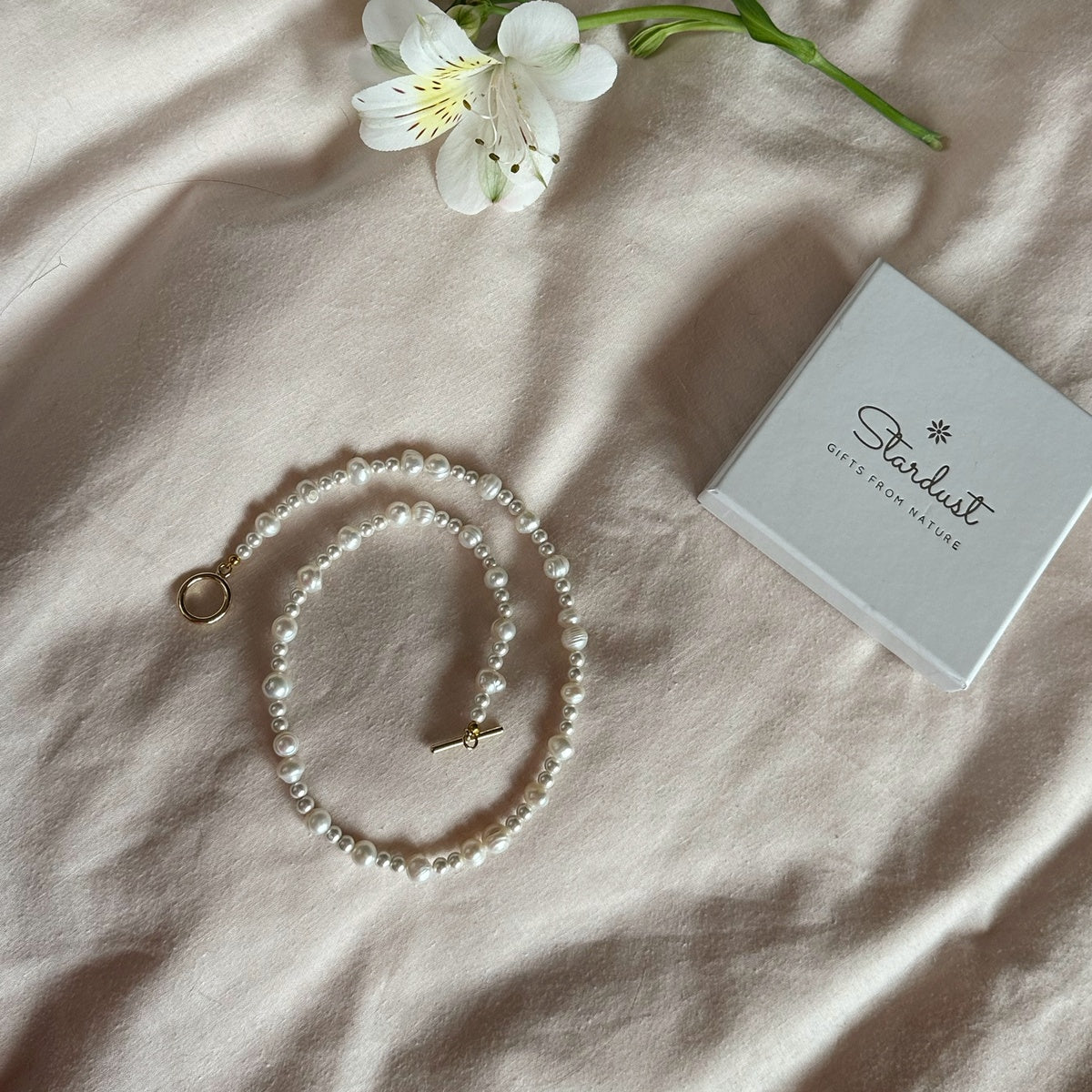 Stylish white pearl choker with toggle gold plated clasp