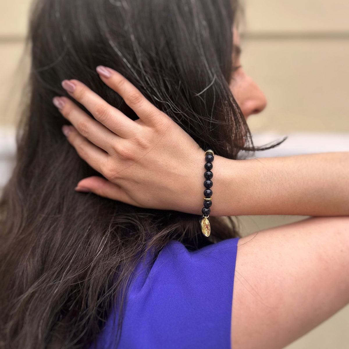 Black Goldstone Bracelet | Antique Gold Eye Charm & Pink Zirconia