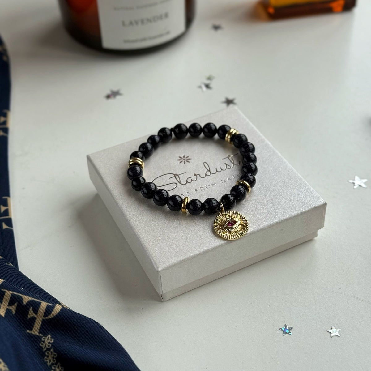 Black Goldstone Bracelet | Antique Gold Eye Charm & Pink Zirconia