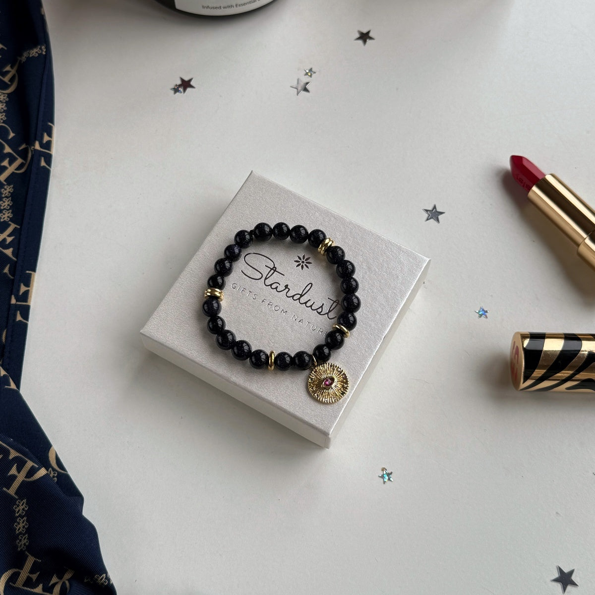 Black Goldstone Bracelet | Antique Gold Eye Charm & Pink Zirconia