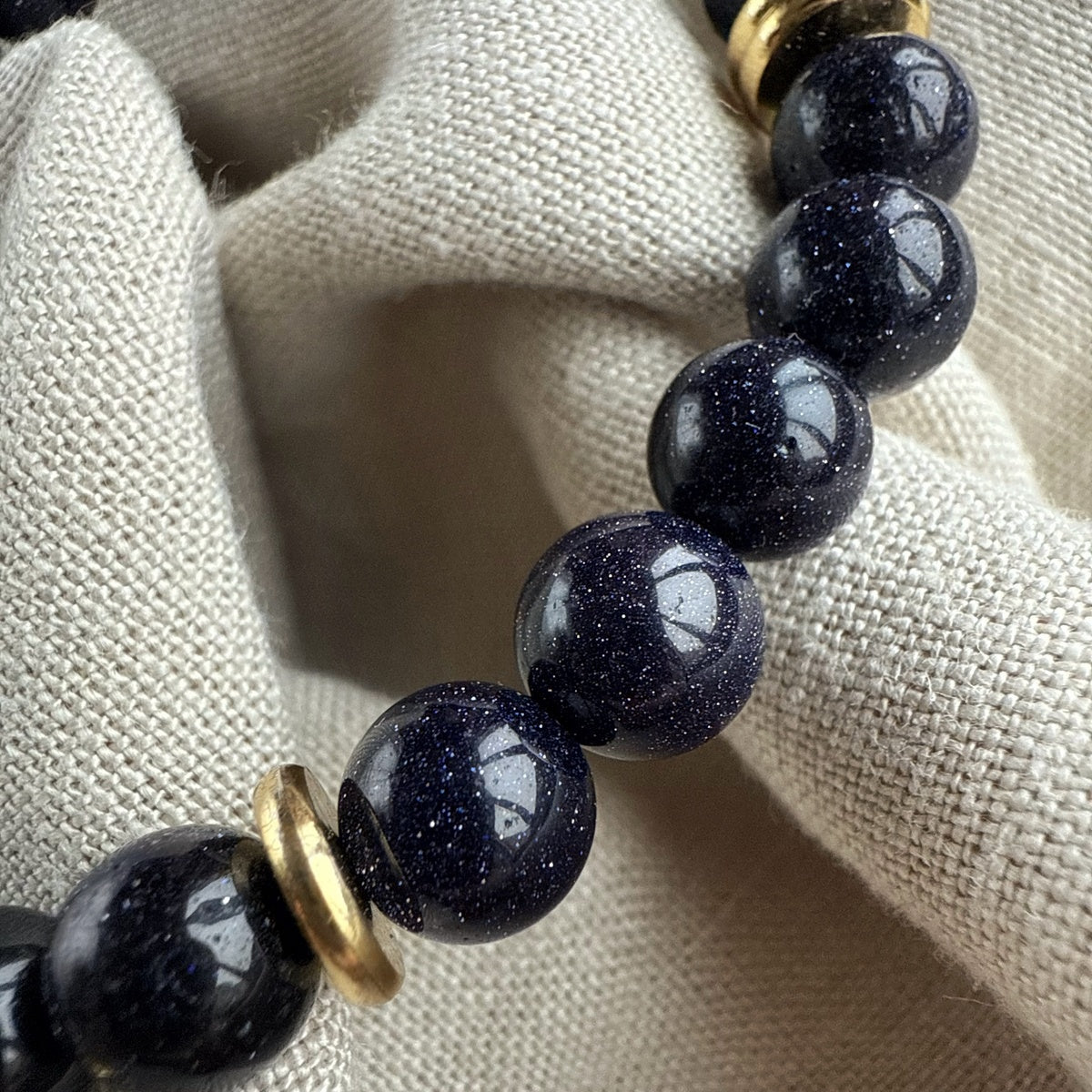 Black Goldstone Bracelet | Antique Gold Eye Charm & Pink Zirconia