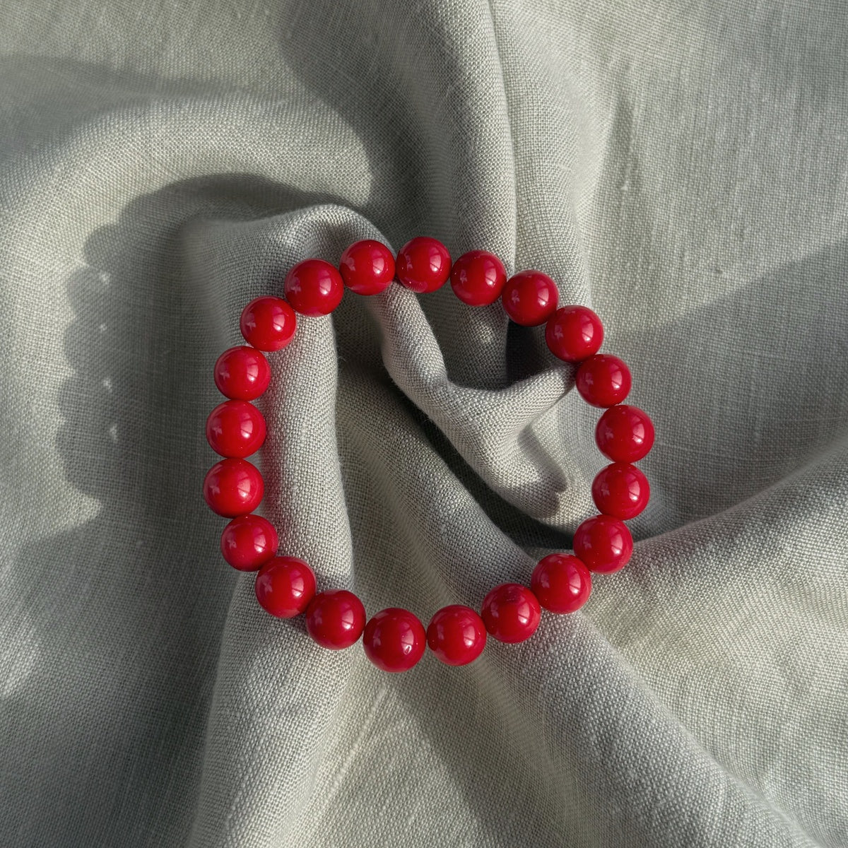 5a Red 8mm Smooth Round Coral Bracelet