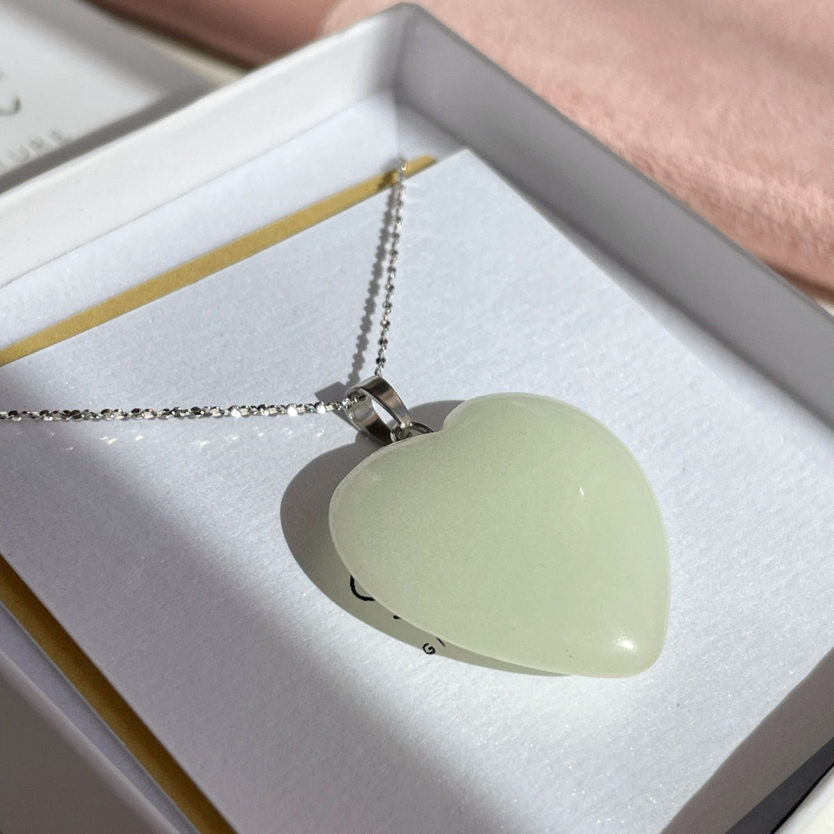 Glowing heart pendant in dark