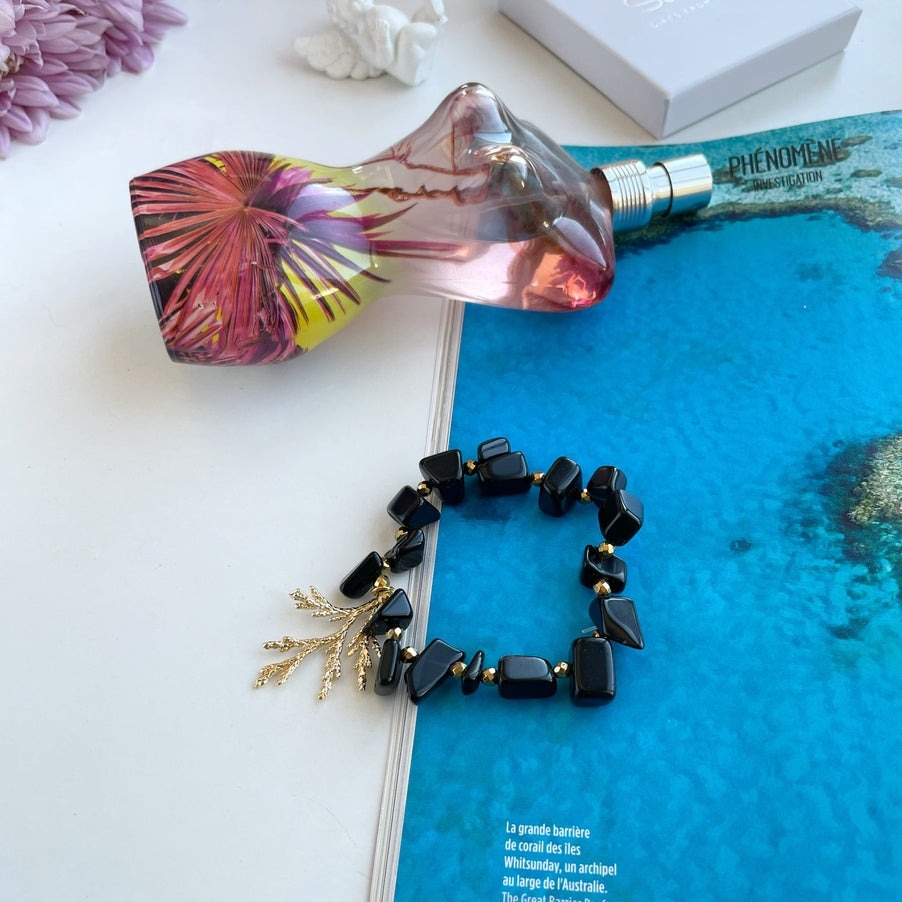 Obsidian bracelet for women with gold coral charm