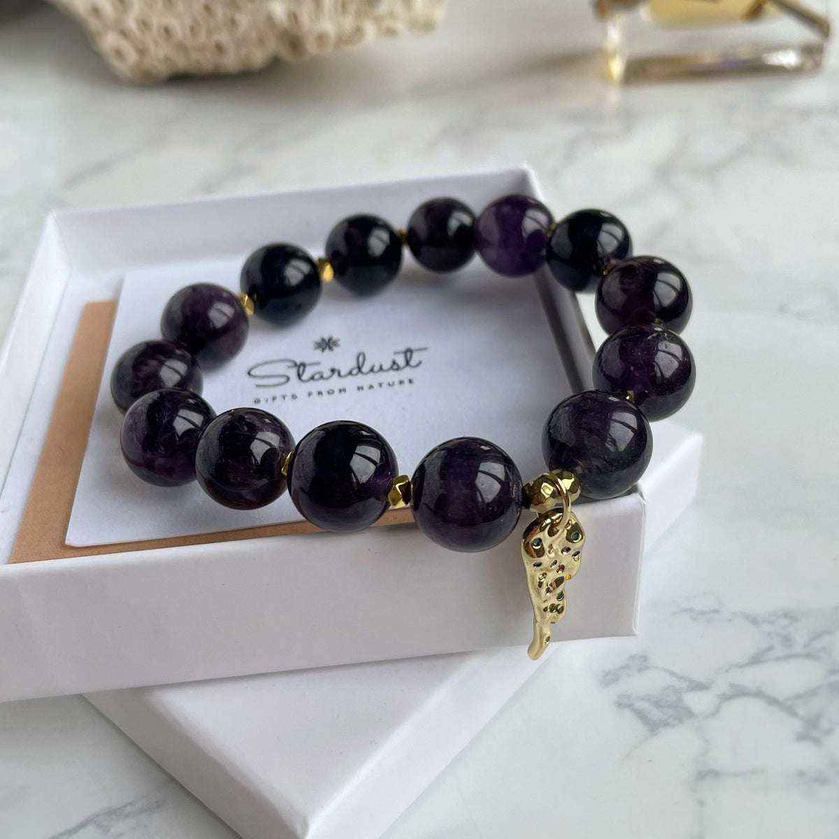 Genuine Amethyst beaded bracelet with Gold feather charm