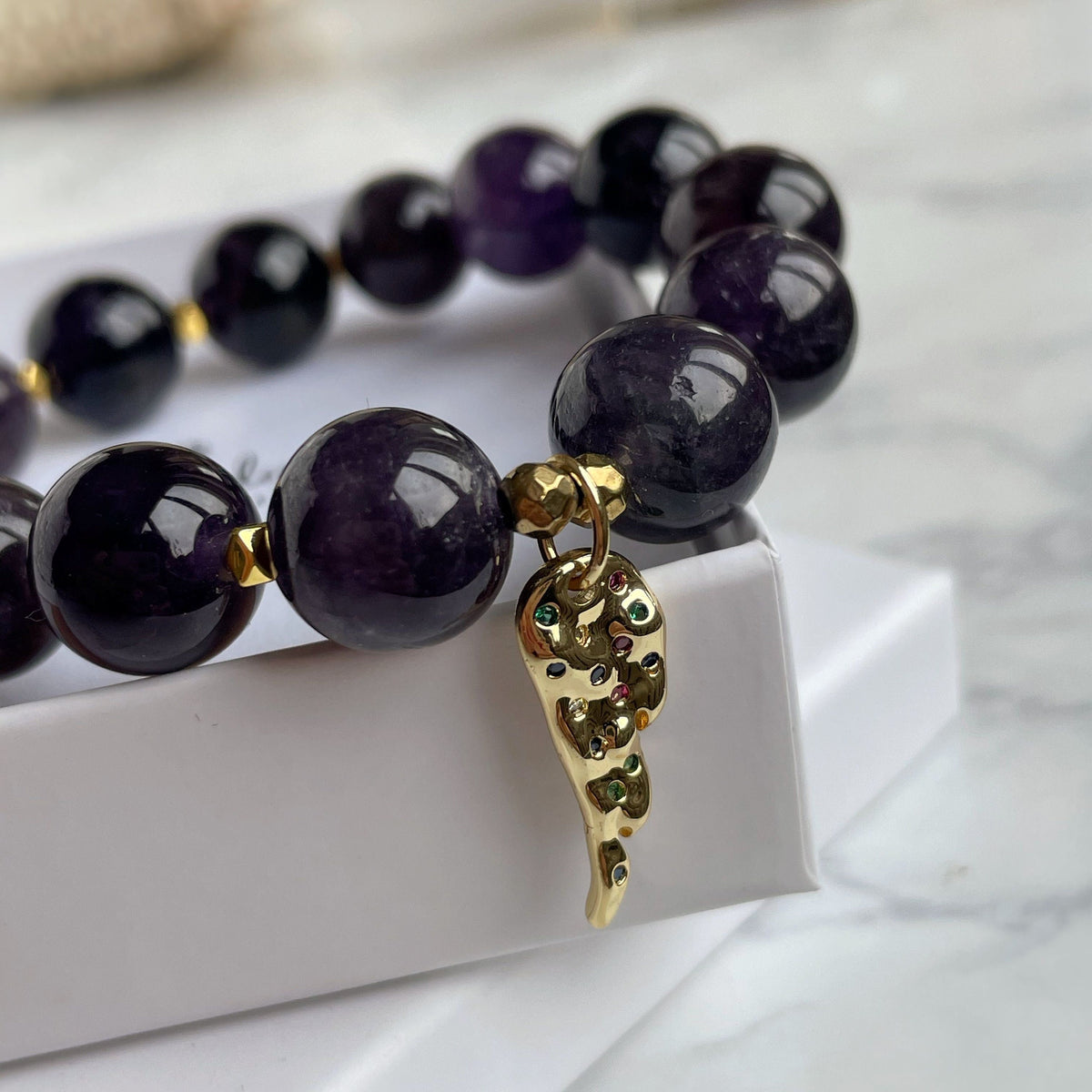 Genuine Amethyst beaded bracelet with Gold feather charm