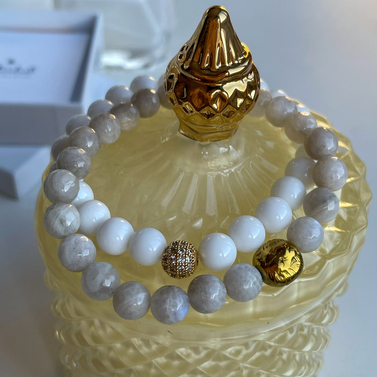 Moonstone and white agate bracelet set with gold lion charm