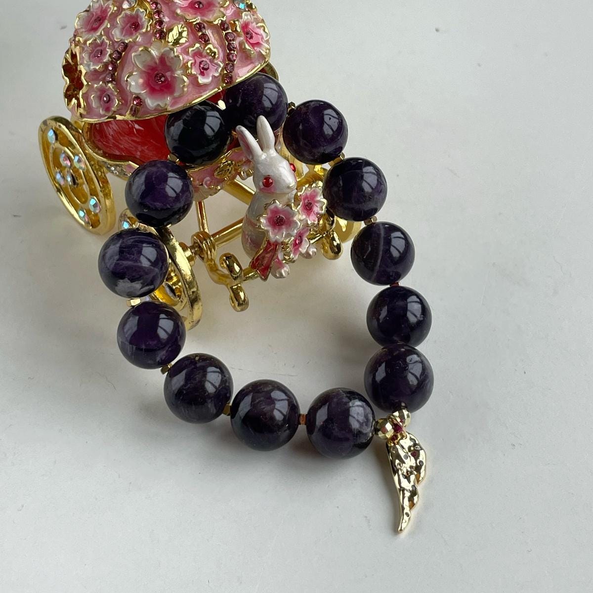 Genuine Amethyst beaded bracelet with Gold feather charm