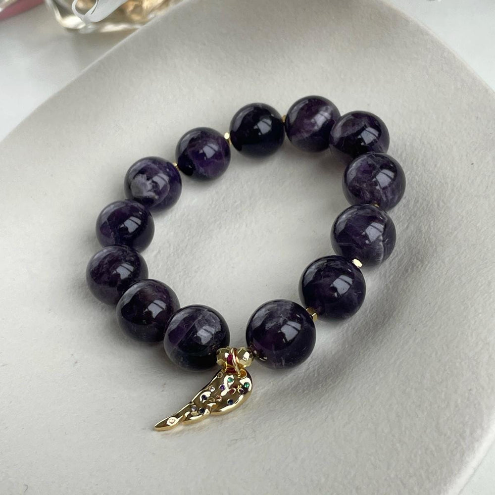 Genuine Amethyst beaded bracelet with Gold feather charm