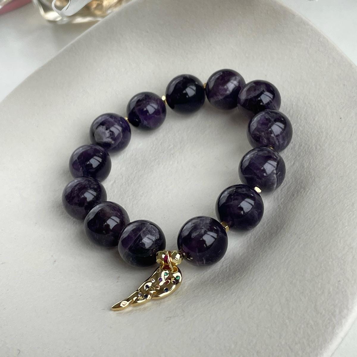 Genuine Amethyst beaded bracelet with Gold feather charm