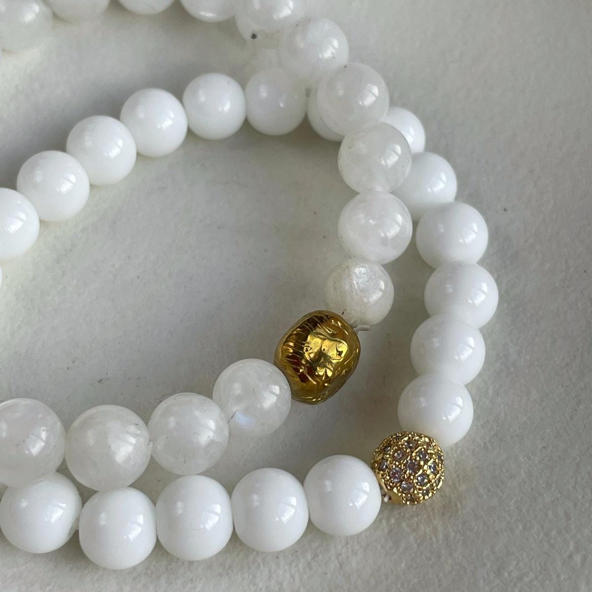 Moonstone and white agate bracelet set with gold lion charm
