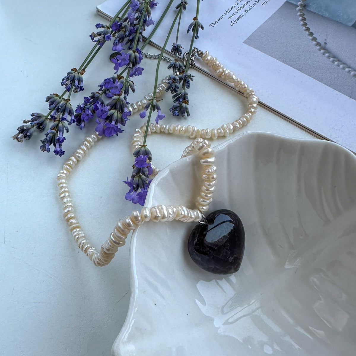 White pearl choker with natural amethyst heart