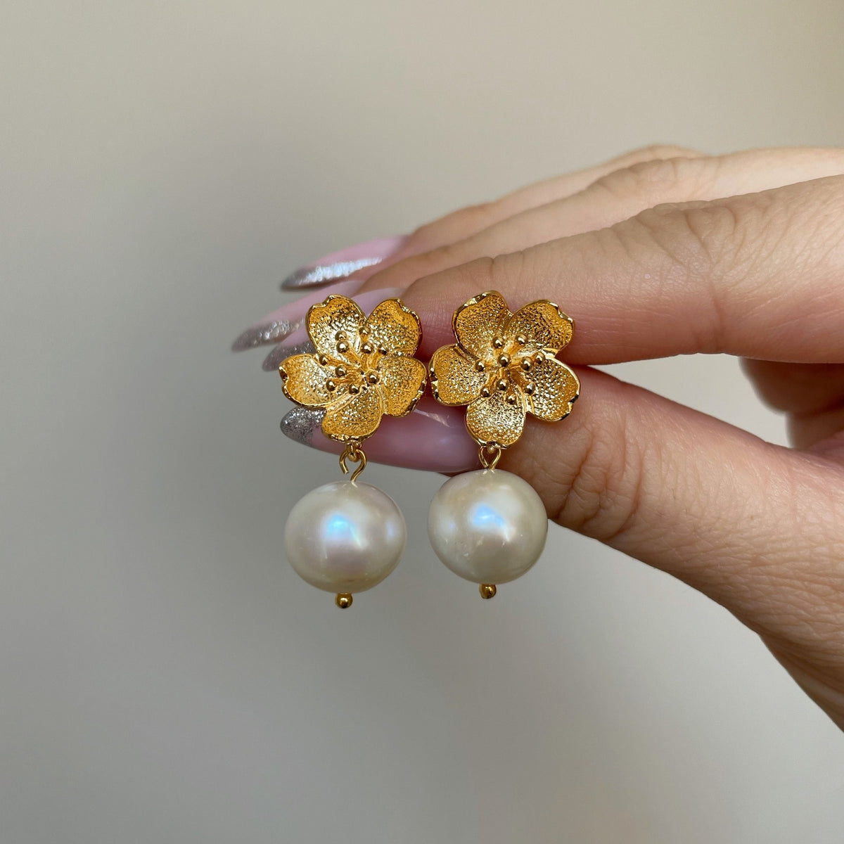 Elegant White Pearl Earrings with gold flowers