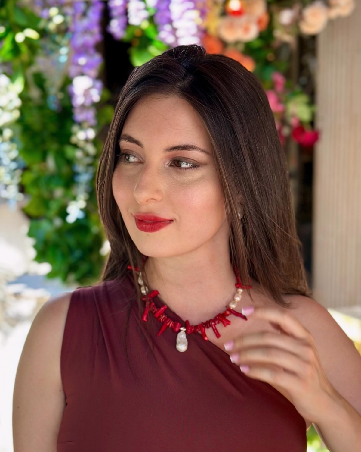 Albena, founder of Stardust Gift, wearing a red coral necklace
