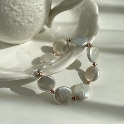 "True Elegance" 15mm Flat White Freshwater Pearl bracelet with Rose Gold Hematite Spacers - Woman