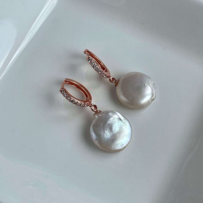 White flat pearl earrings