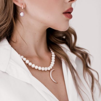 White pearl necklace with rose gold moon
