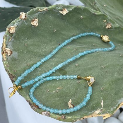 Aquamarine necklace with gold charm
