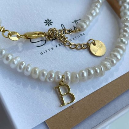 pearl choker with gold letter
