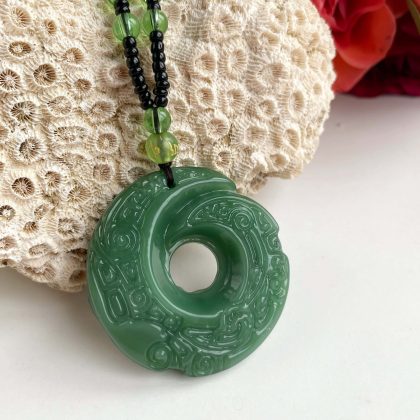 Large carved Green Jade circle pendant