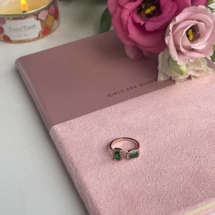 Rose gold ring with green crystals