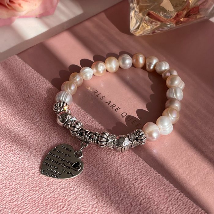 Peach pearl bracelet with charm