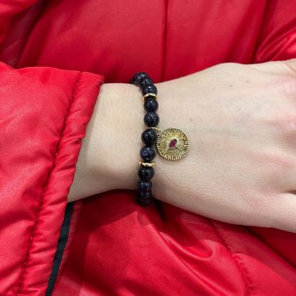 Blue goldstone bracelet with coin charm